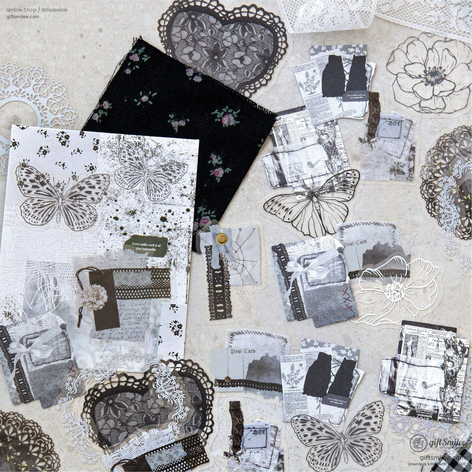 Black and white butterfly and lace ephemera displayed with vintage floral elements for journaling