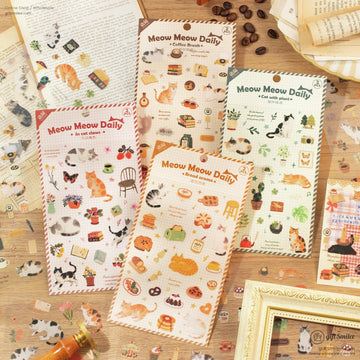 Four cozy-themed Meow Meow Daily sticker packs featuring cats, coffee, plants, and bread designs