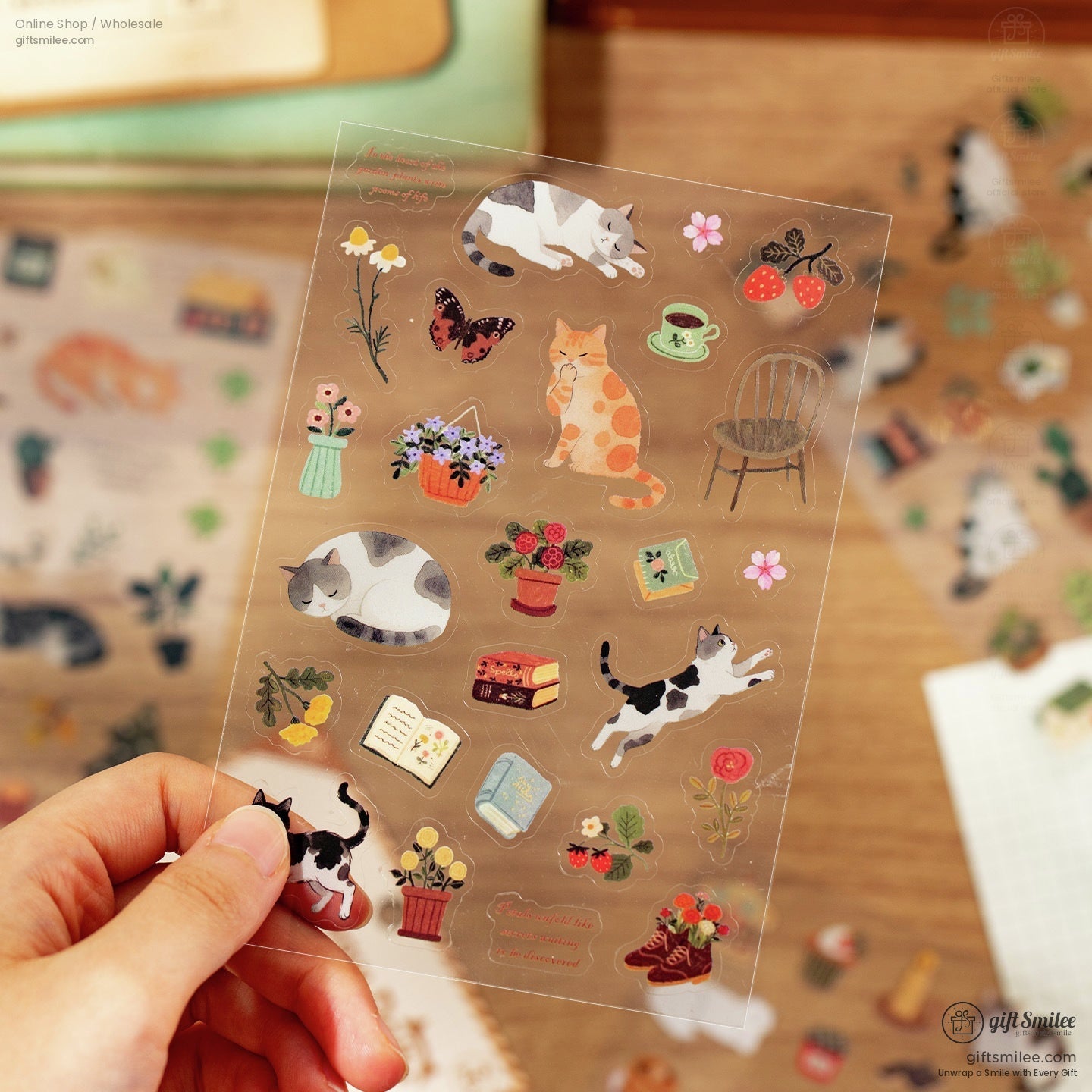 Close-up of a single sheet featuring cats, flowers, books, and cozy home items