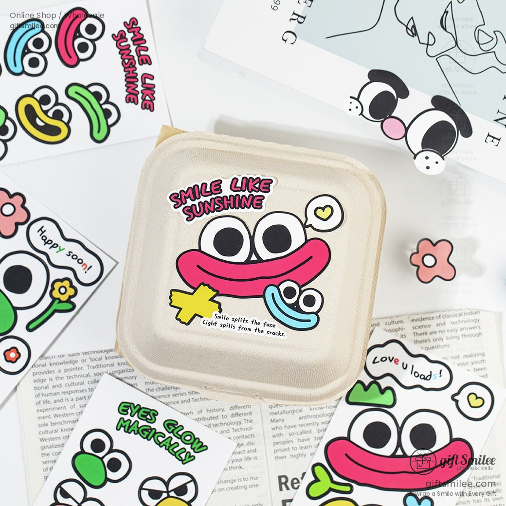 Close-up of a sticker pouch featuring a Smile Like Sunshine cartoon design