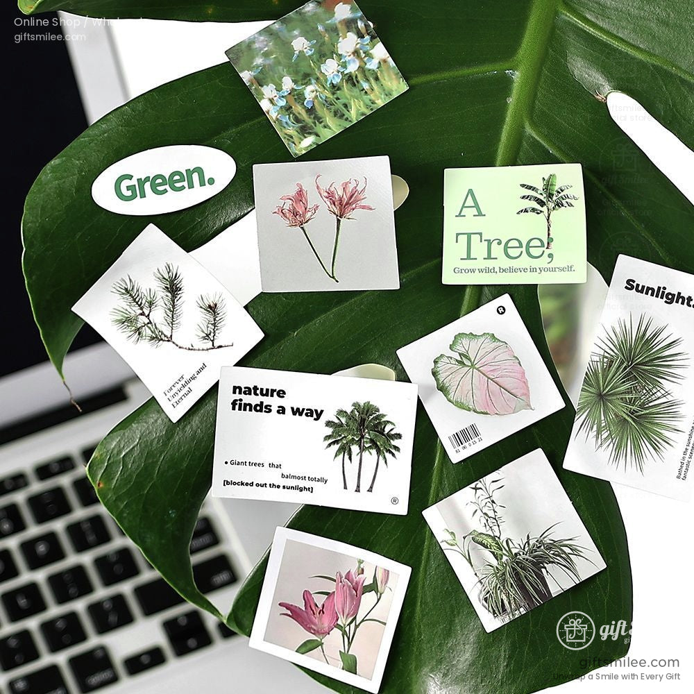 Green leaf backdrop with botanical stickers, including trees, flowers, and inspirational messages