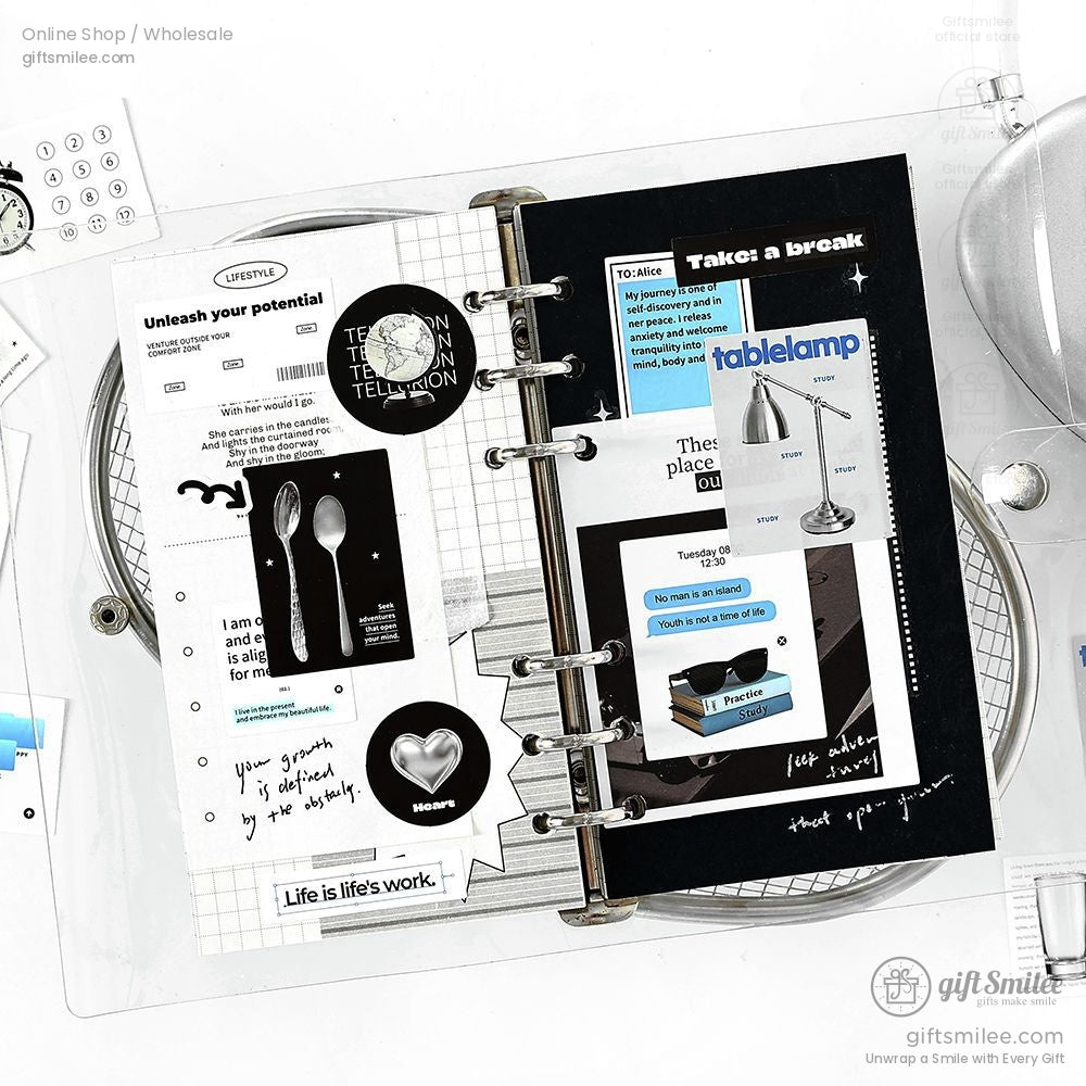Planner pages decorated with black-and-white and colorful stickers, perfect for journaling and DIY crafts