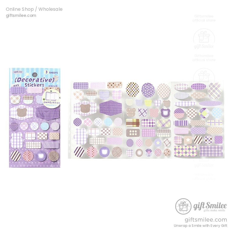 Close-up of purple-themed gingham and plaid decorative stickers for bullet journaling