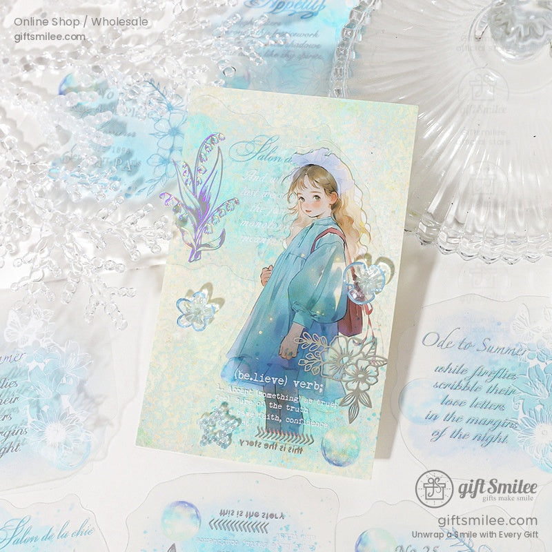 An artistic postcard with a girl in a blue outfit, adorned with intricate floral sticker designs and vintage patterns
