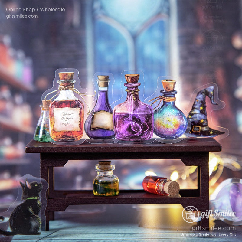 Close-up of miniature potion bottles in vibrant colors on a wooden table with a black cat figurine