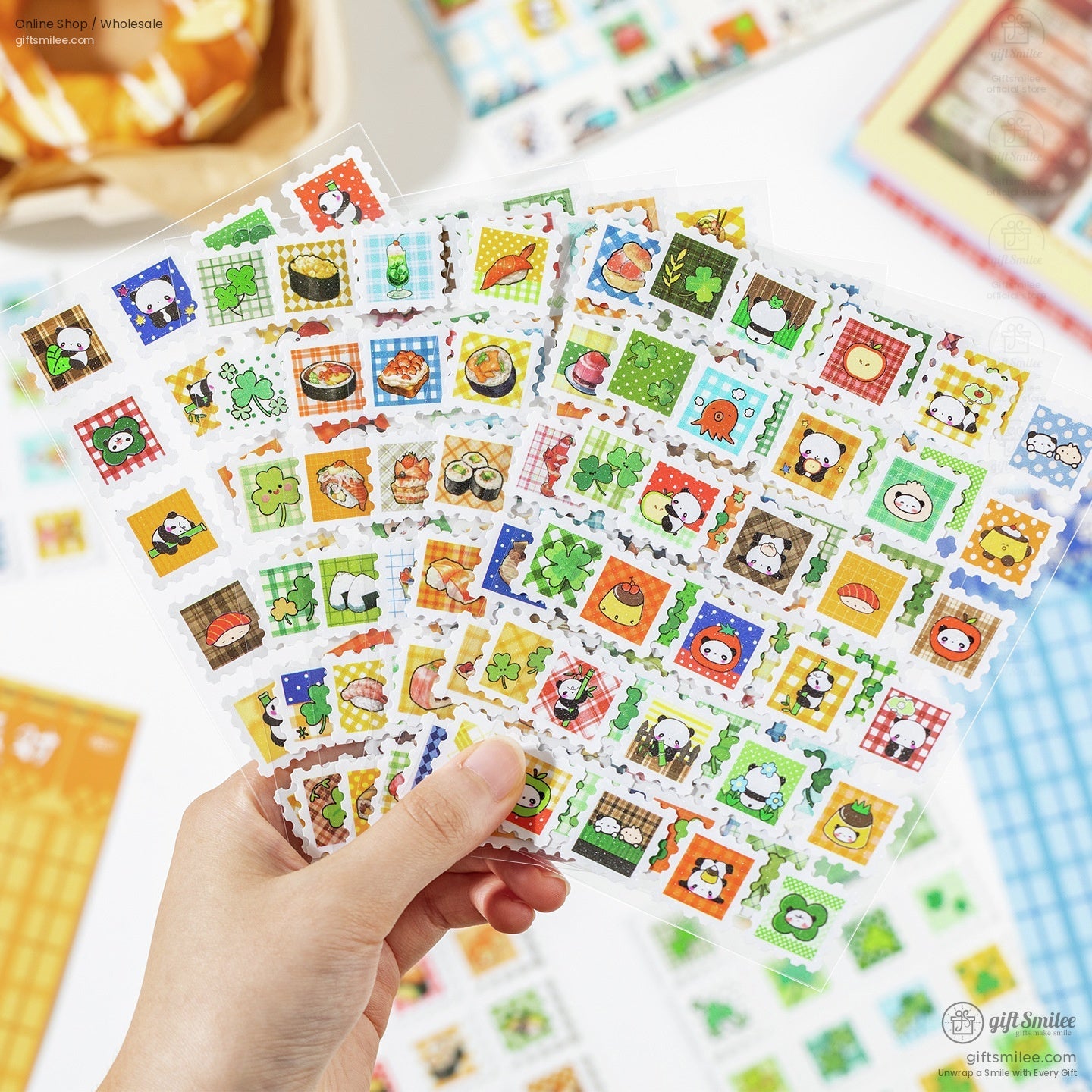 Hand holding a variety of vibrant kawaii mini stamp stickers with sushi, clovers, and cute animals