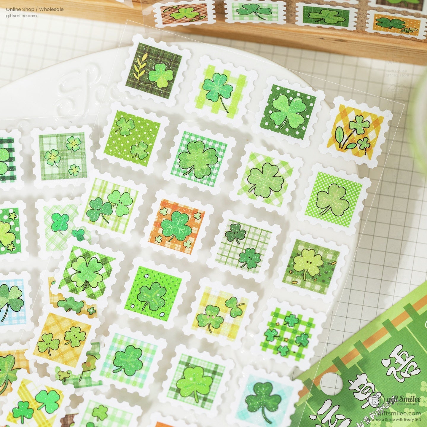 Close-up of green clover-themed mini stamp stickers arranged neatly on a plate