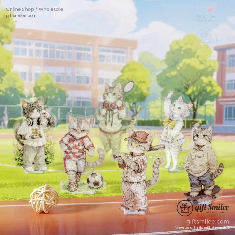 Sporty-themed cat standees playing baseball, soccer, and skateboarding outdoors