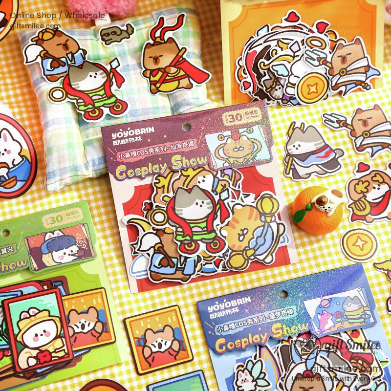 Assorted cosplay animal stickers displayed with packaging on a plaid surface