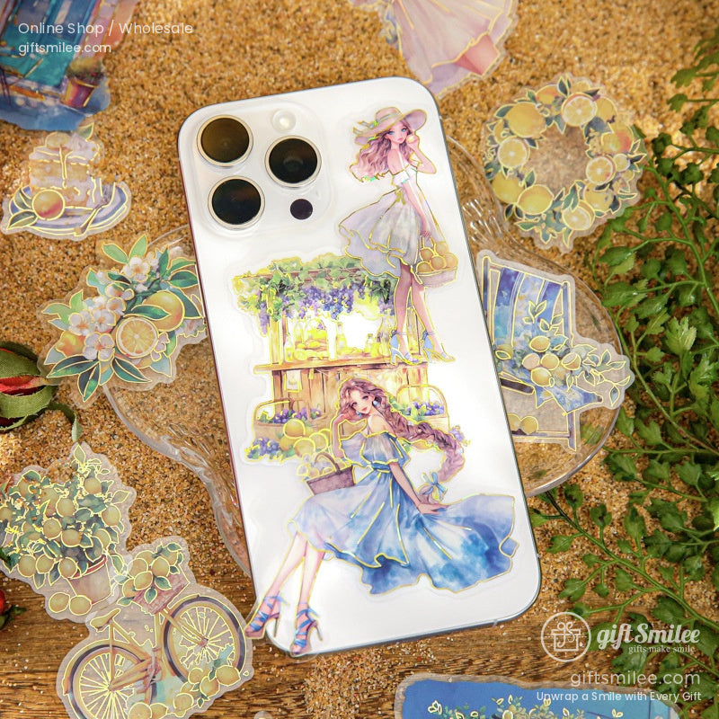 A phone adorned with vibrant holographic stickers featuring summer vacation themes, lemons, and chic girls