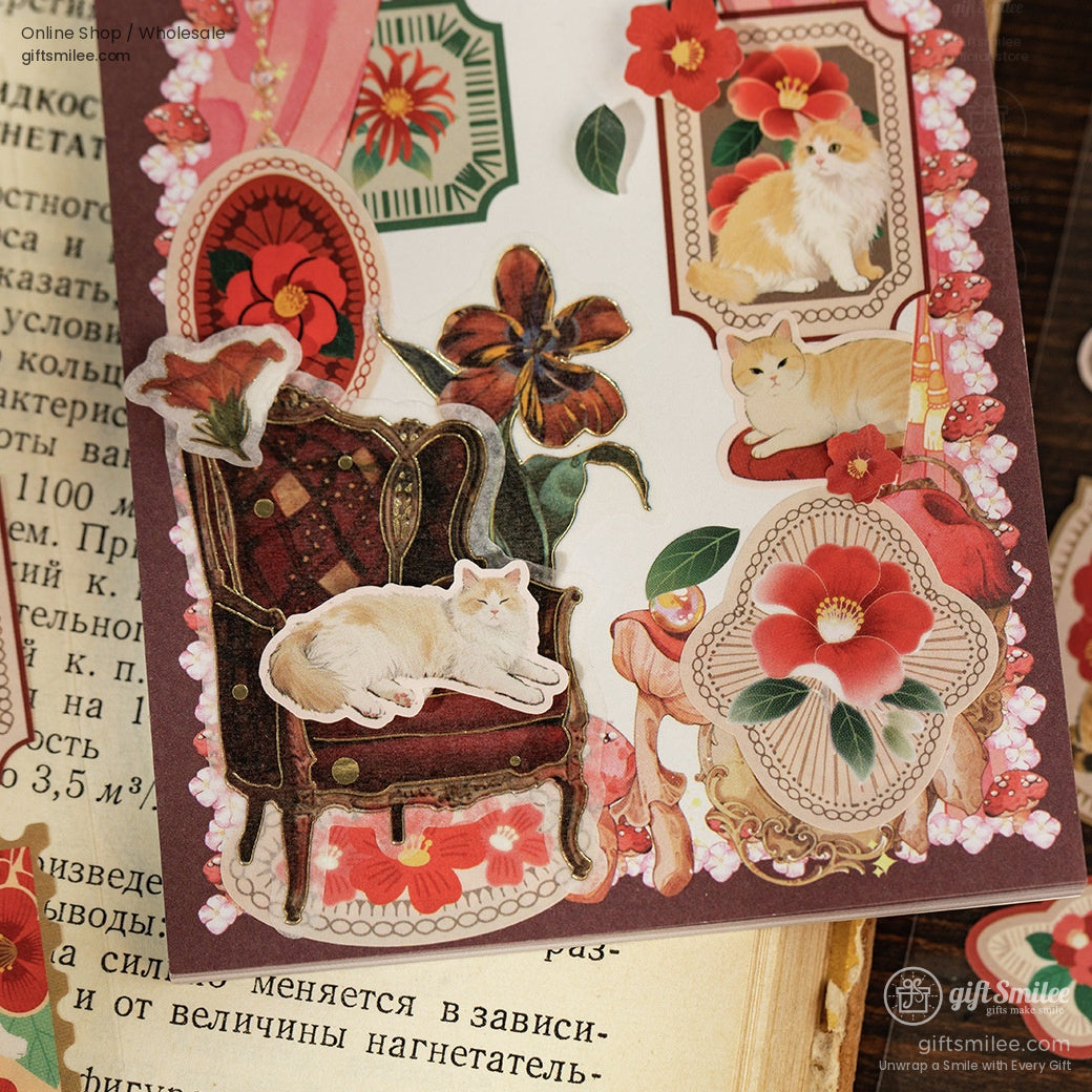 Close-up of a retro-style sticker sheet featuring cats, flowers, and ornate designs for creative decoration