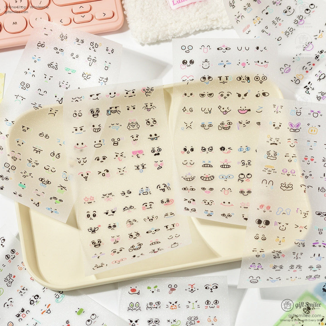 Close-up of pink and pastel anime face expression stickers with cute designs