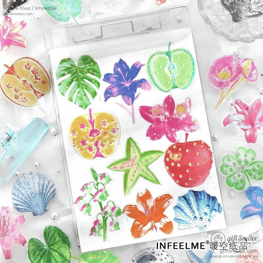 A variety of stickers, including apples, flowers, and ocean-inspired designs, beautifully arranged for crafts and DIY projects
