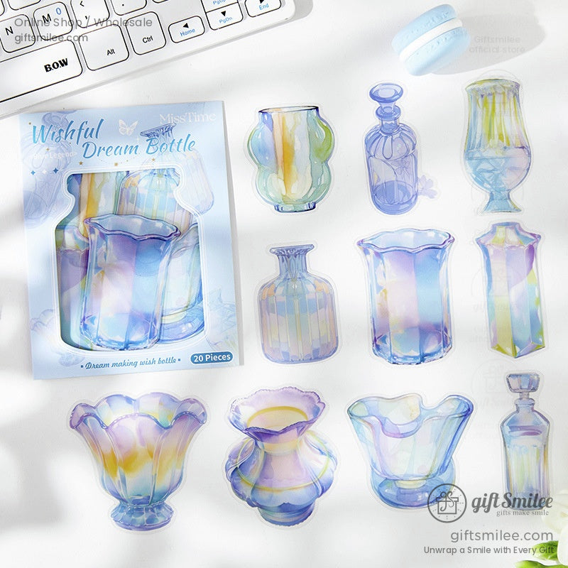 Close-up of holographic bottle-shaped stickers arranged near a keyboard, showcasing their vibrant design