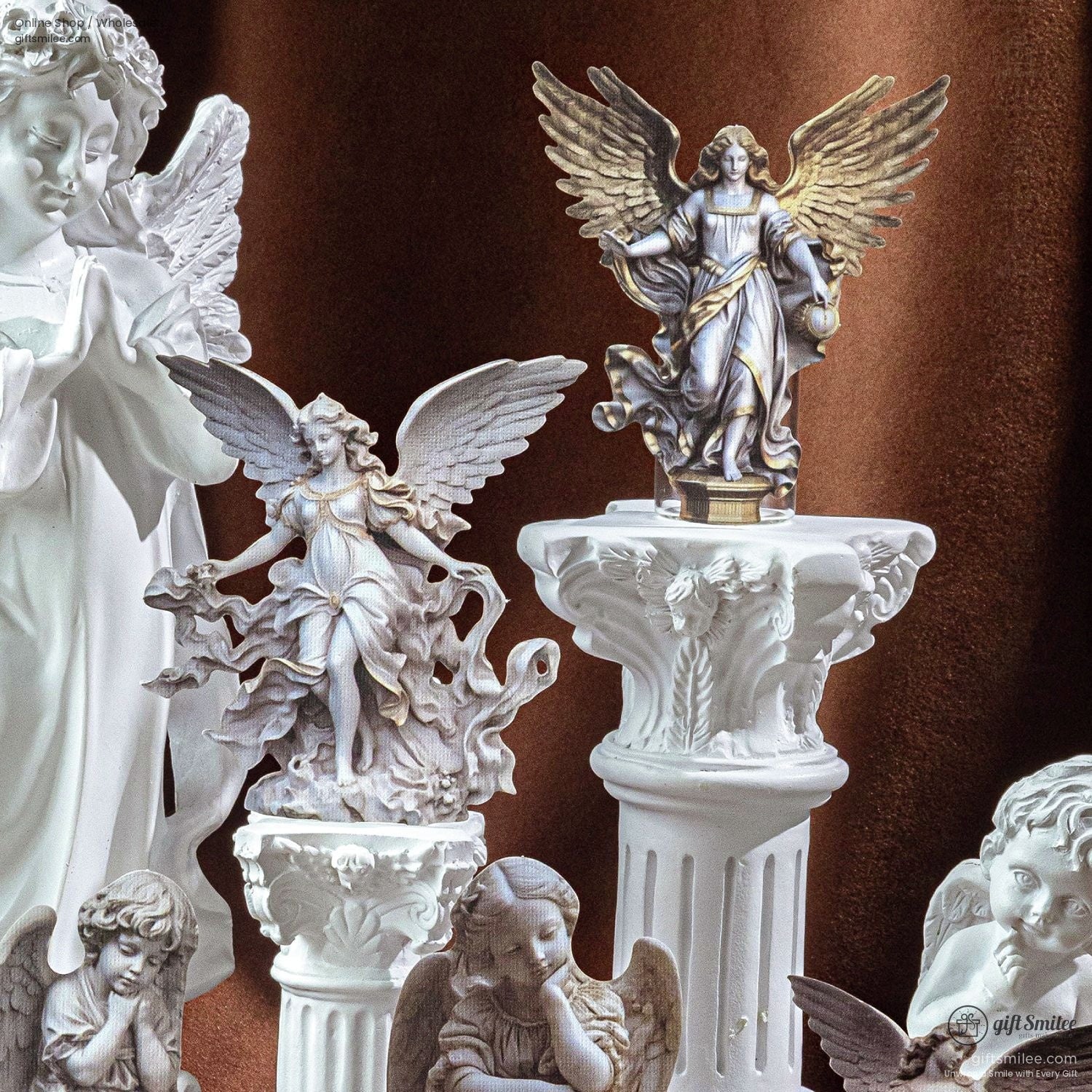 Close-up of angel statues on decorative pedestals with classic Baroque styling