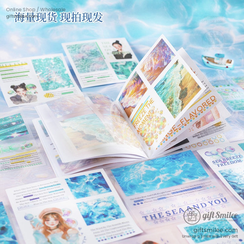 Open pages of an ocean-themed stationery set showcasing vibrant illustrations and beach-inspired designs