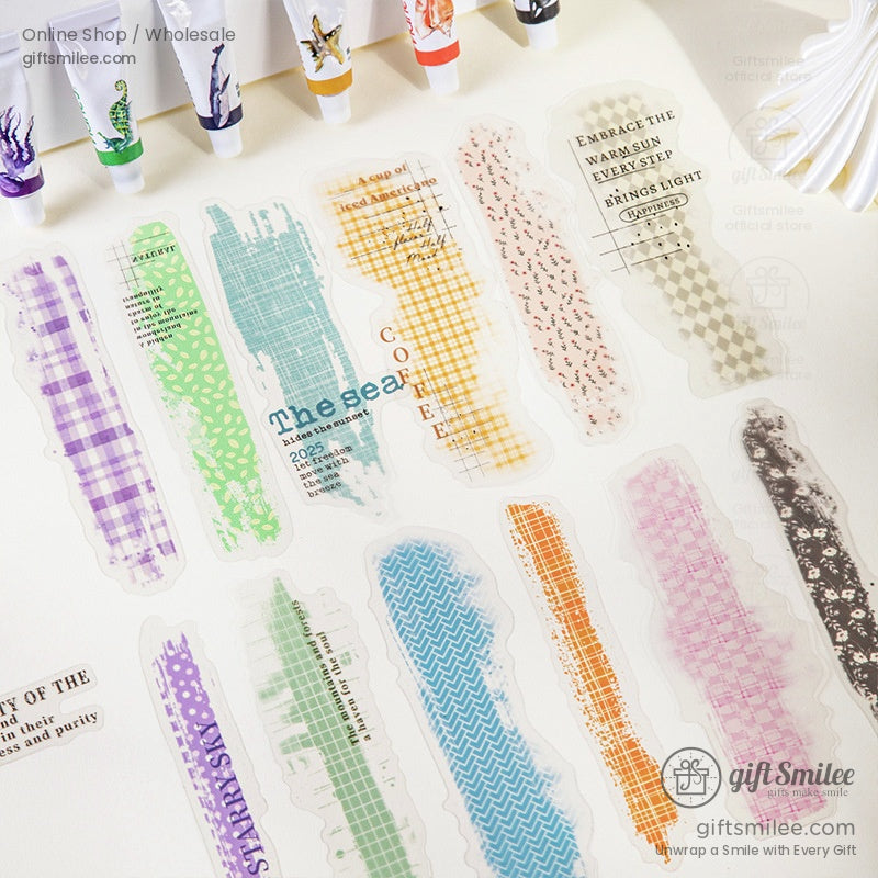 Colorful transparent washi stickers arranged with pastel tones and artistic typography for crafting and journaling