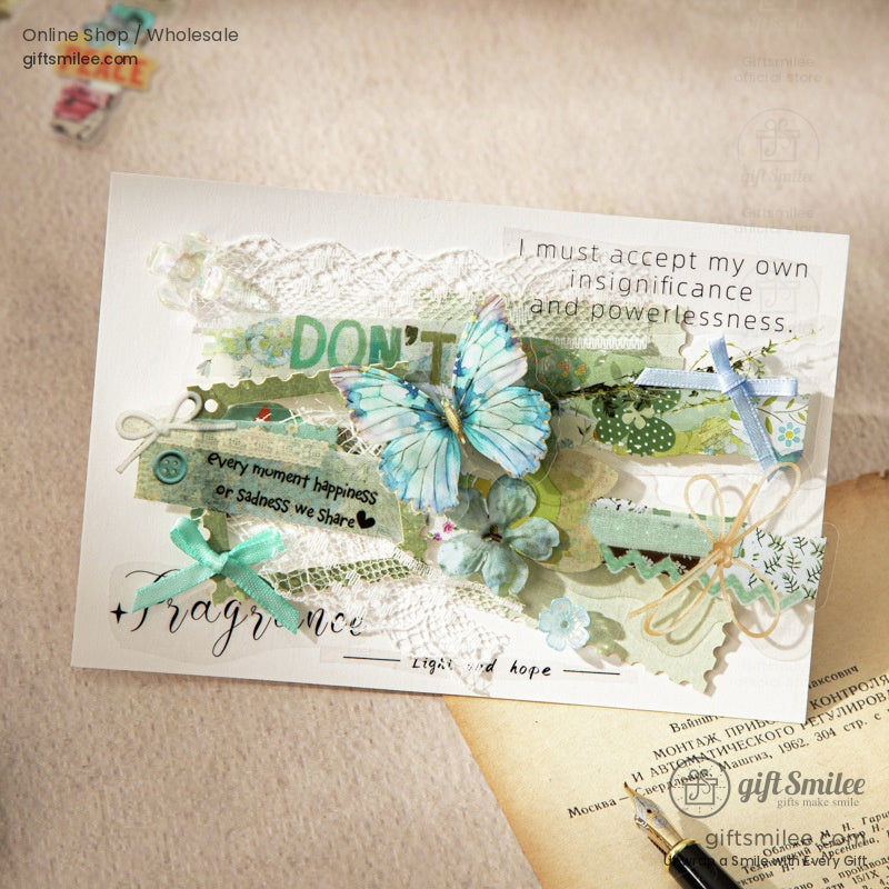 A handmade card adorned with butterfly-themed vintage stickers and lace decorations for crafting inspiration