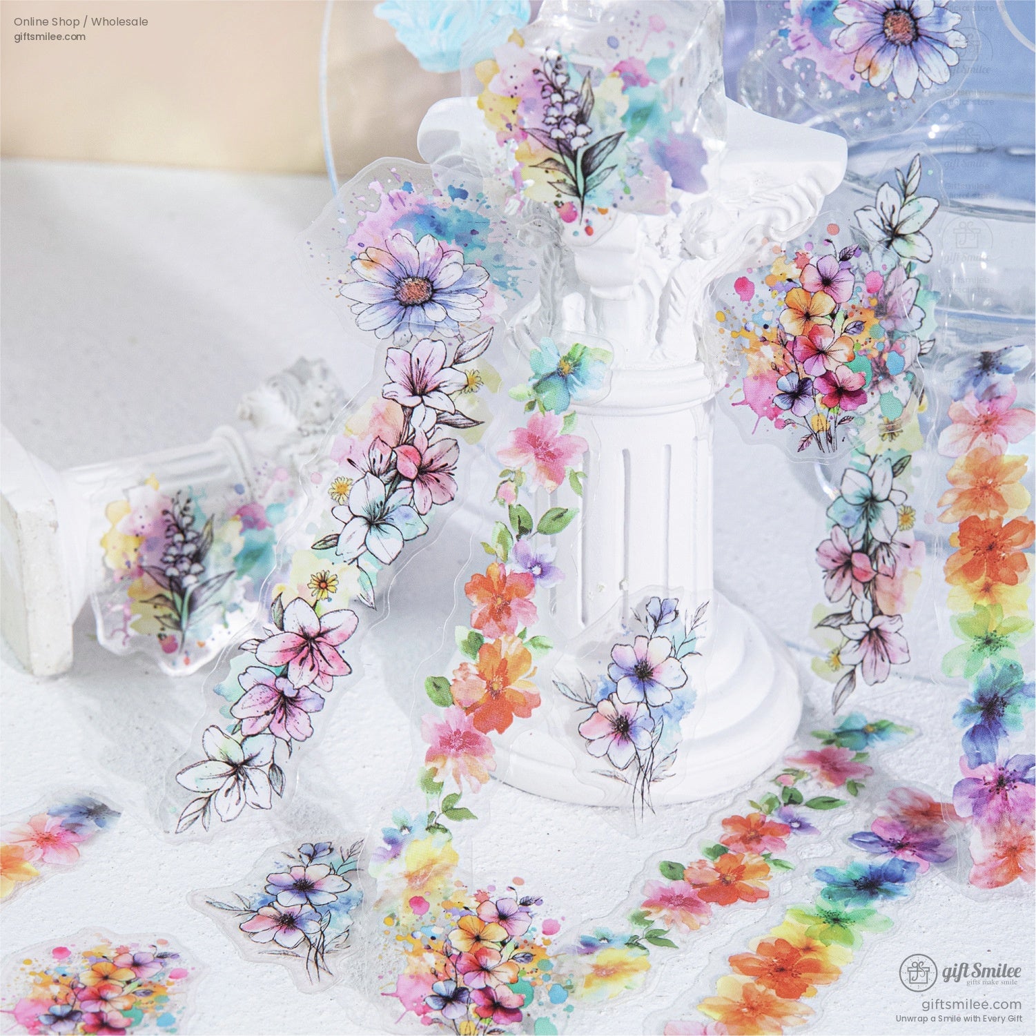 Elegant floral stickers with watercolor designs draped around a white figurine for decoration