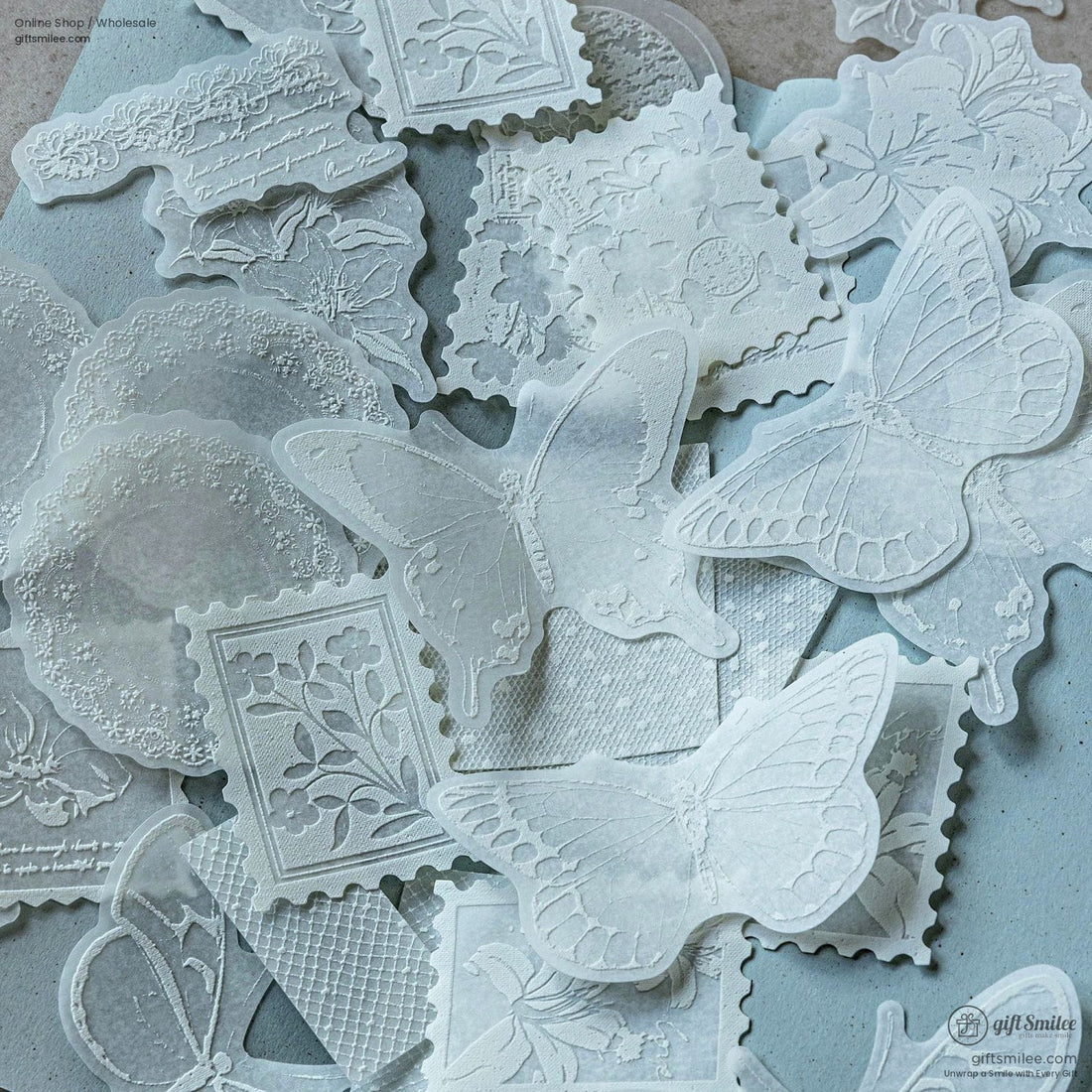 Close-up of elegant transparent embossed butterfly and floral stickers on a soft background