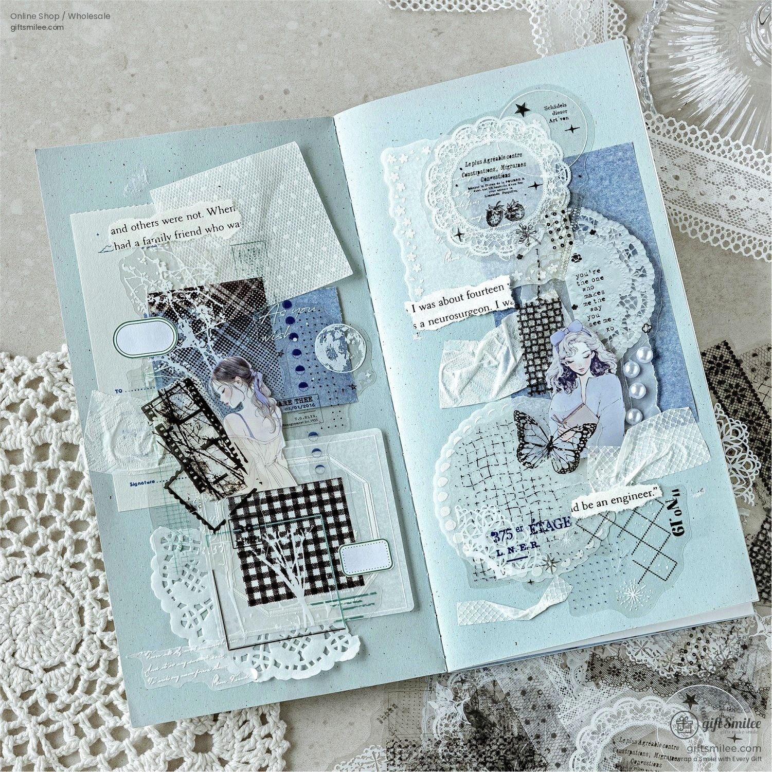 A creative journal spread decorated with celestial and vintage transparent stickers, showcasing their versatile use in scrapbooking