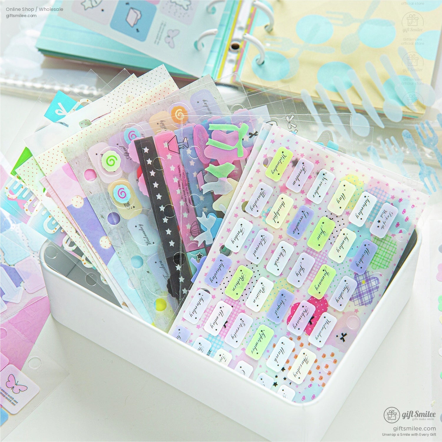 A collection of decorative stickers in a white box for crafting and journaling