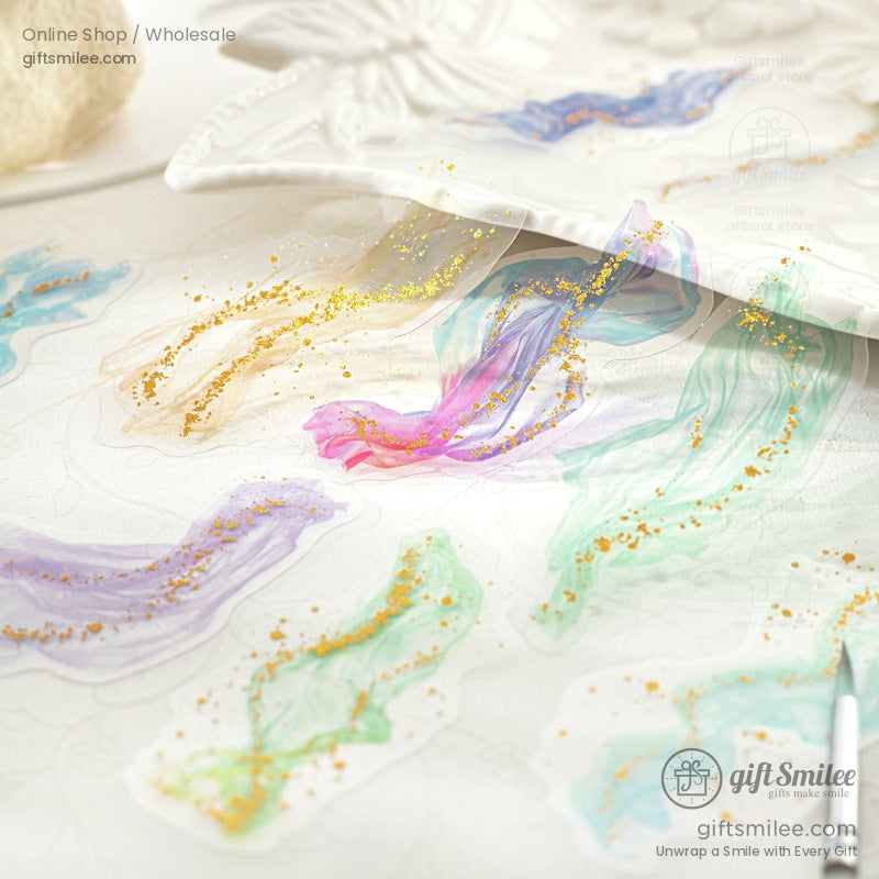 Ethereal golden gauze glitter stickers on a delicate display table