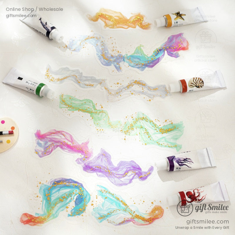 Ethereal golden gauze glitter stickers on a delicate display table