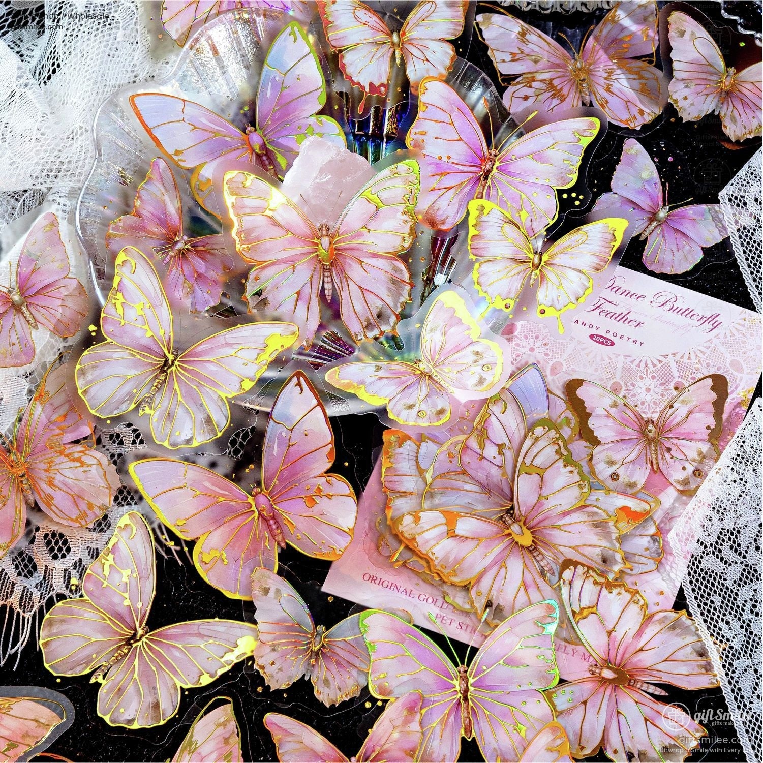 Pastel pink butterfly stickers with elegant gold detailing, styled on a lace table