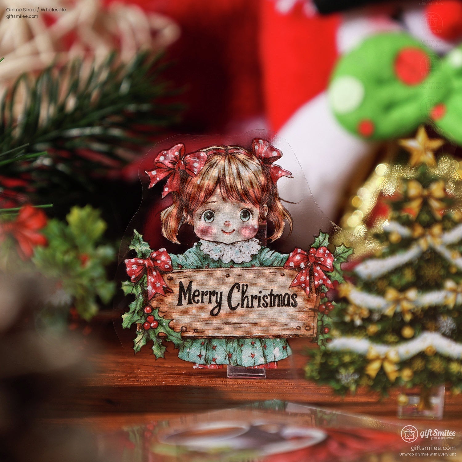 Close-up of a Merry Christmas sticker featuring a little girl with red bows