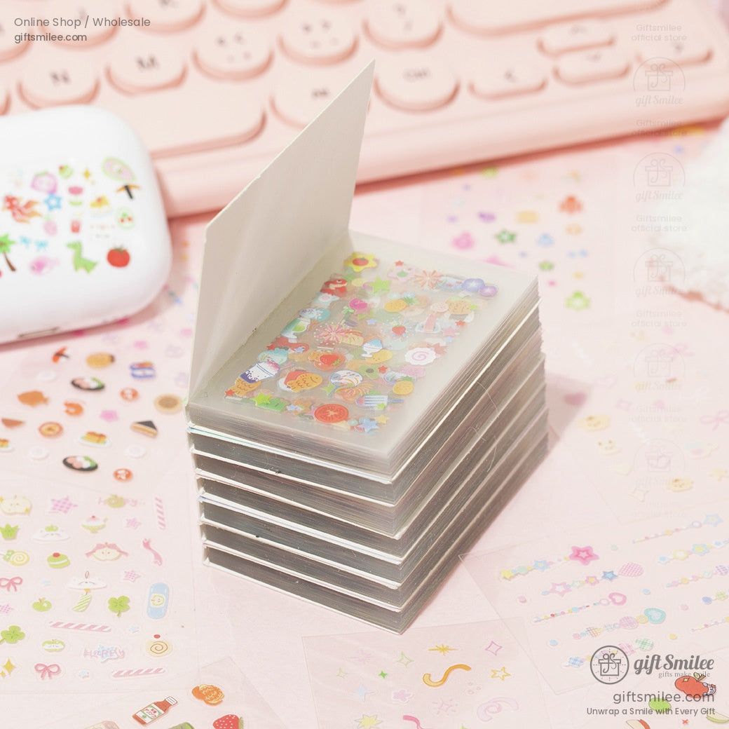 A set of colorful kawaii-themed stickers featuring animals, flowers, and decorations displayed on a pink surface