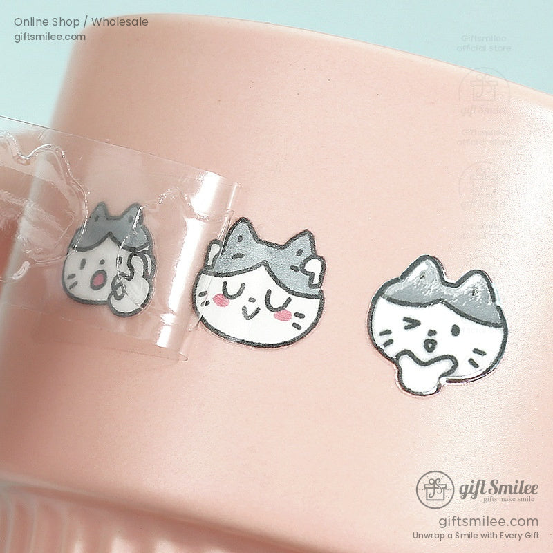 Close-up of cat stickers applied to a pink cup