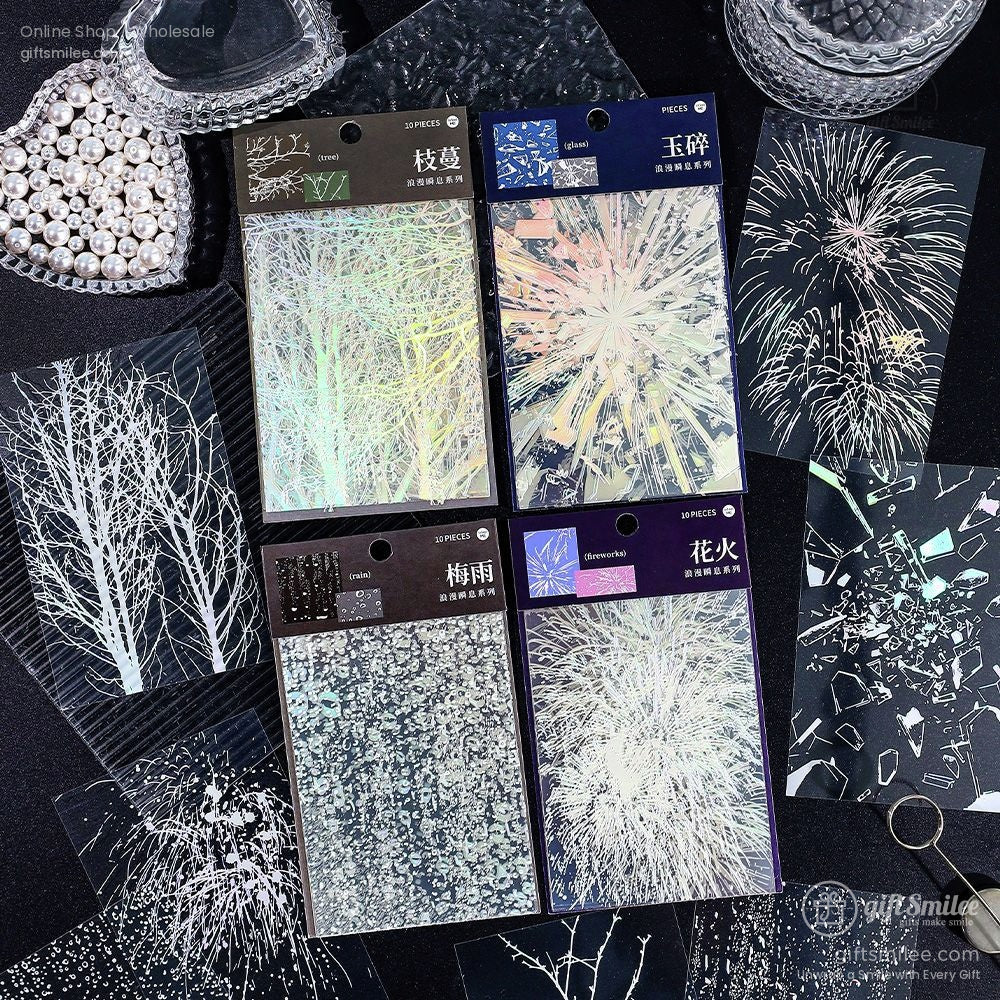 Holographic scrapbooking stickers with glass shard and abstract designs, displayed on a black background