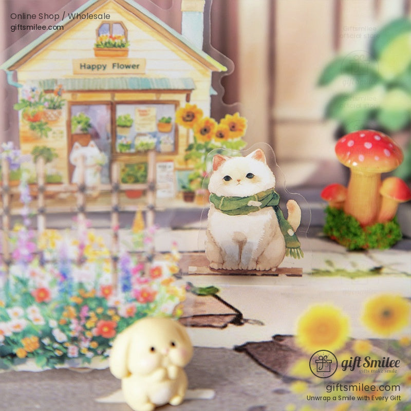 A charming cat wearing a green scarf in front of a flower shop surrounded by vibrant blooms and mushrooms