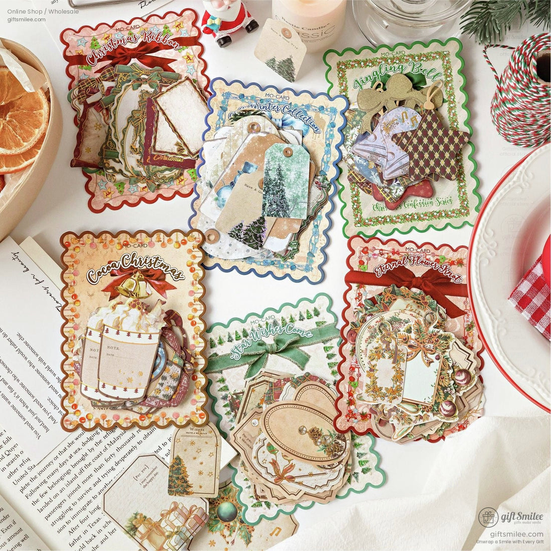 Image of vintage Christmas-themed ephemera sets for scrapbooking, featuring festive tags, stickers, and die cuts