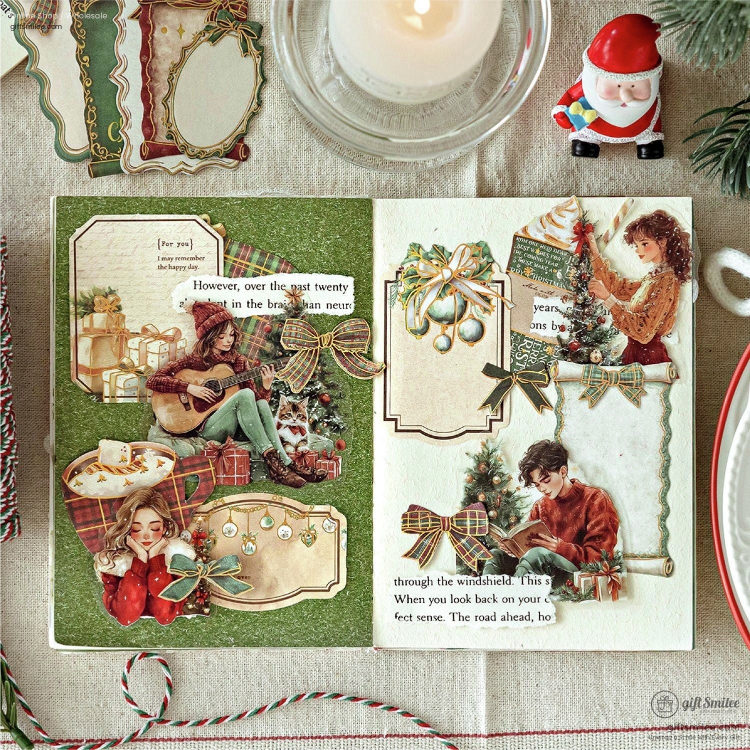 Open scrapbook page decorated with festive ephemera, ribbons, and holiday-themed illustrations