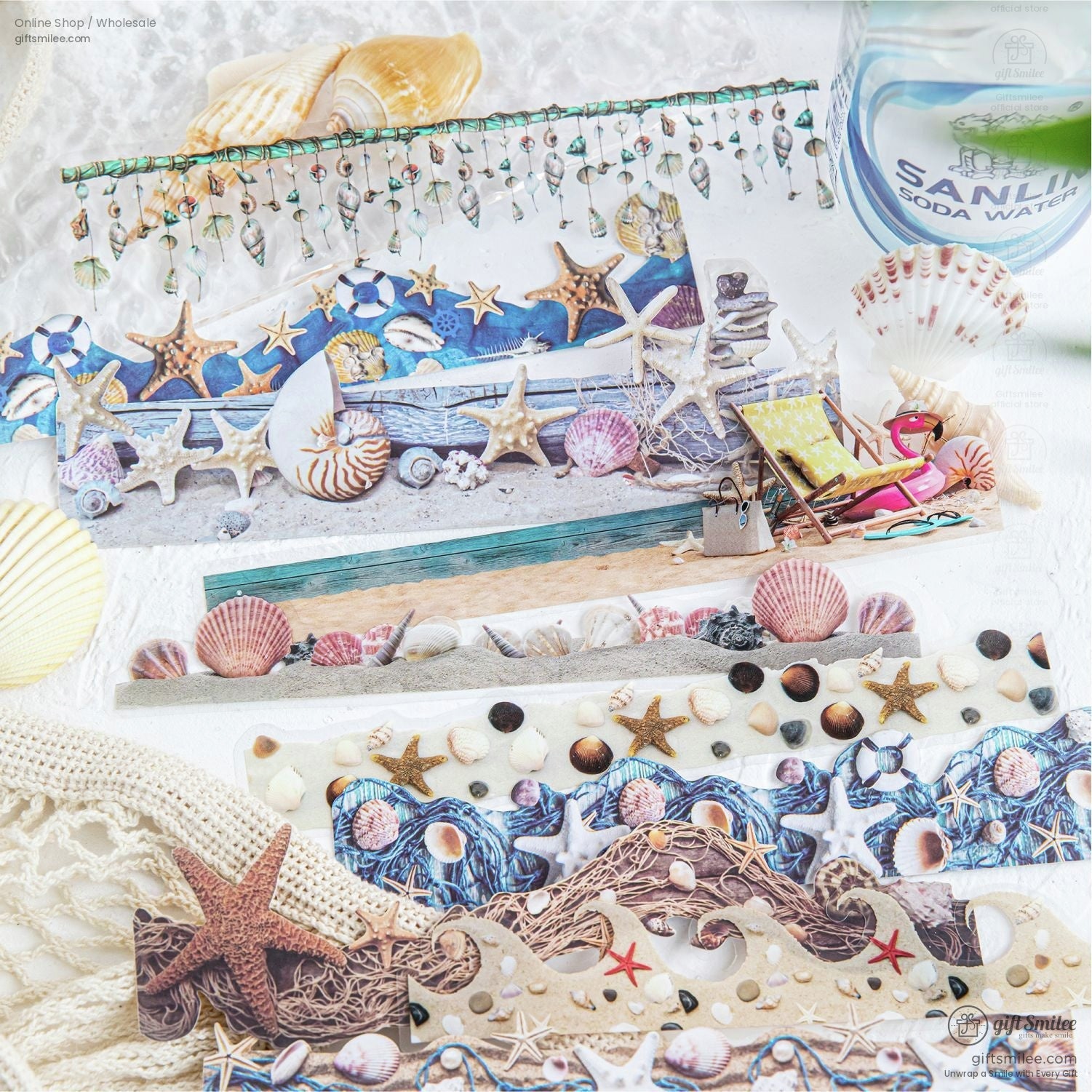 Close-up of ocean-themed washi tape rolls featuring seashells, starfish, and nautical designs arranged with seashell props