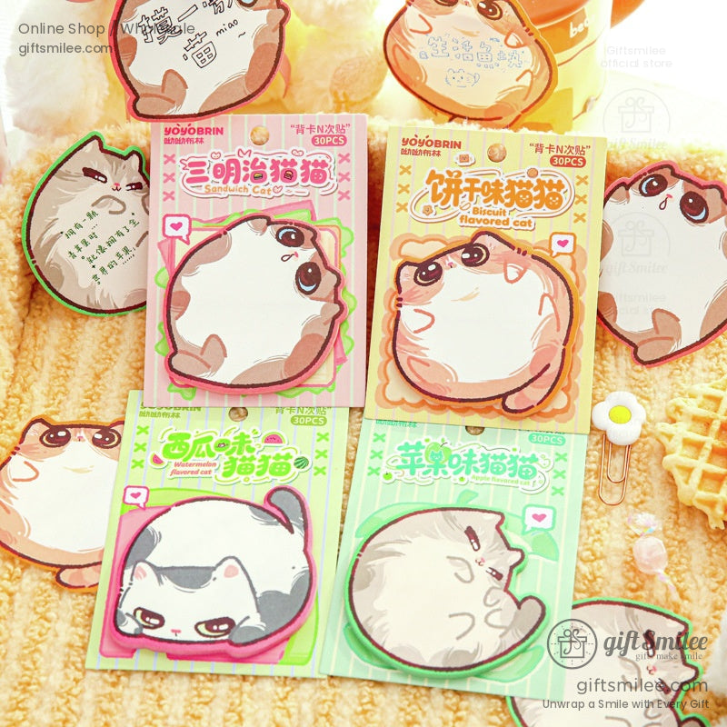 Cute sandwich and fruit-flavored cartoon cat sticky notes displayed on a cozy background