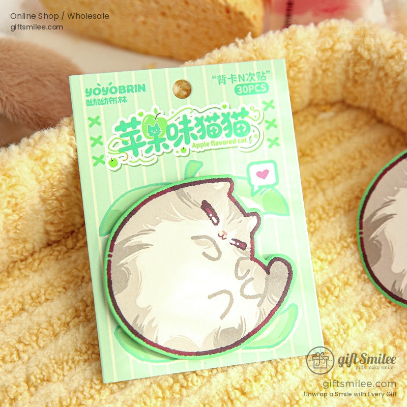 Close-up of an apple-flavored cat sticky note pad with adorable details