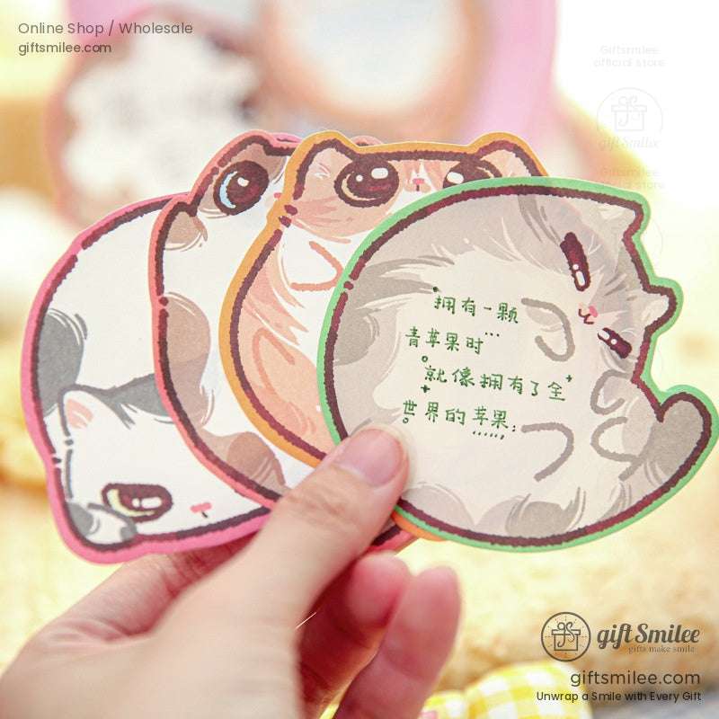 A handful of colorful cartoon cat sticky notes in sandwich and fruit designs