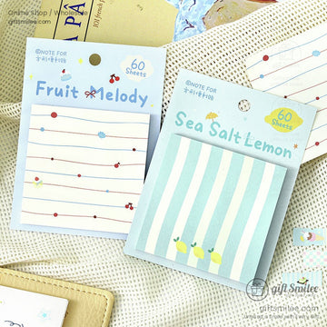 Two pastel notepads titled Fruit Melody and Sea Salt Lemon with cherry and lemon designs