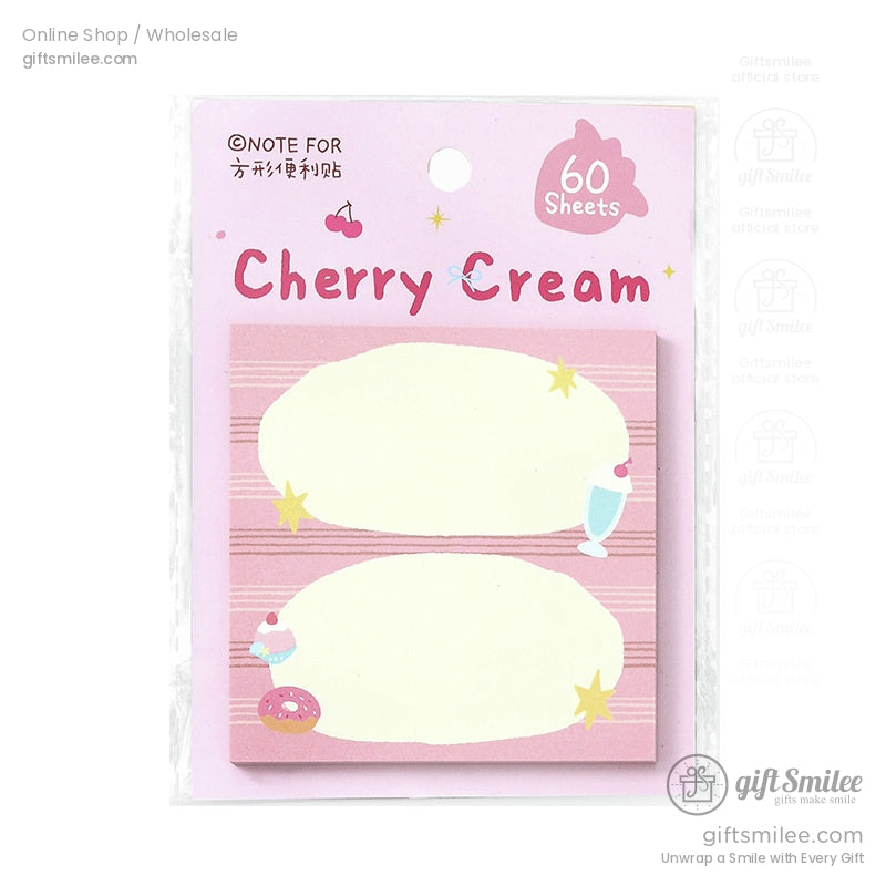 A close-up of the Cherry Cream notepad with pink dessert-themed illustrations of donuts and milkshakes