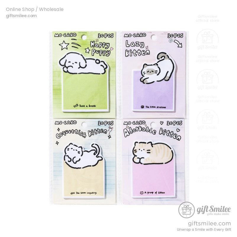 A set of four packaged sticky notes featuring kittens and puppies, perfect as a gift for stationery lovers