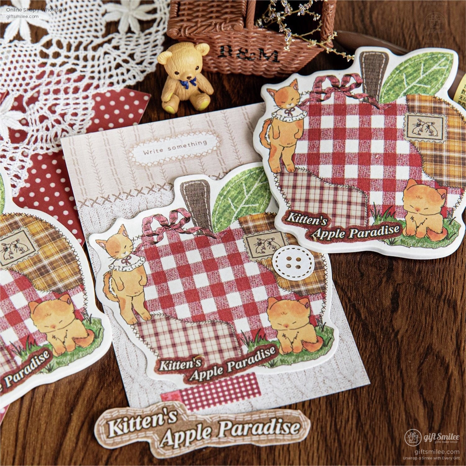 Close-up of Kittens Apple Paradise sticker pack with plaid and farm-inspired designs, surrounded by crafting supplies