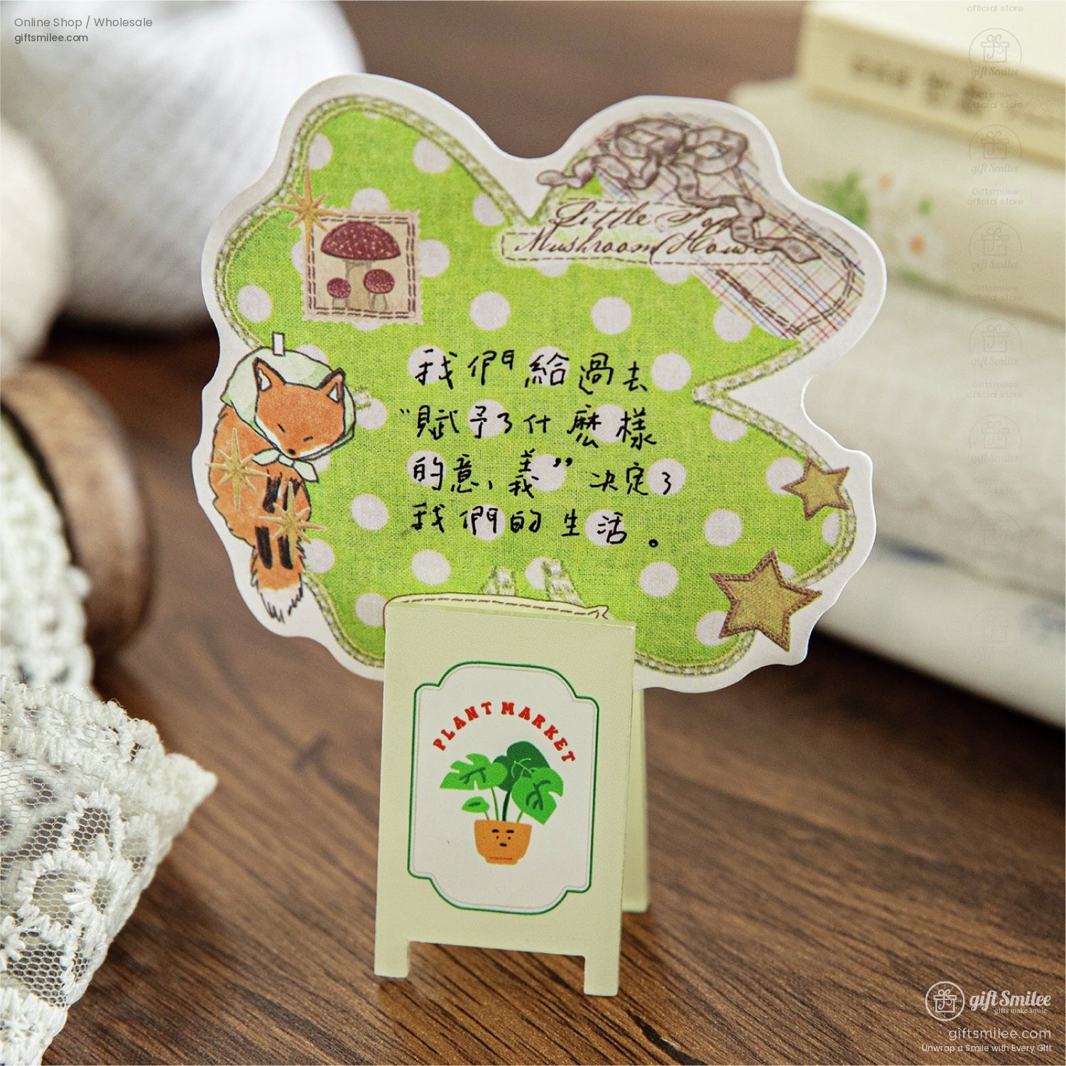 A detailed look at a single Mushroom House sticker with a fox and polka dot background, paired with lace and miniature props