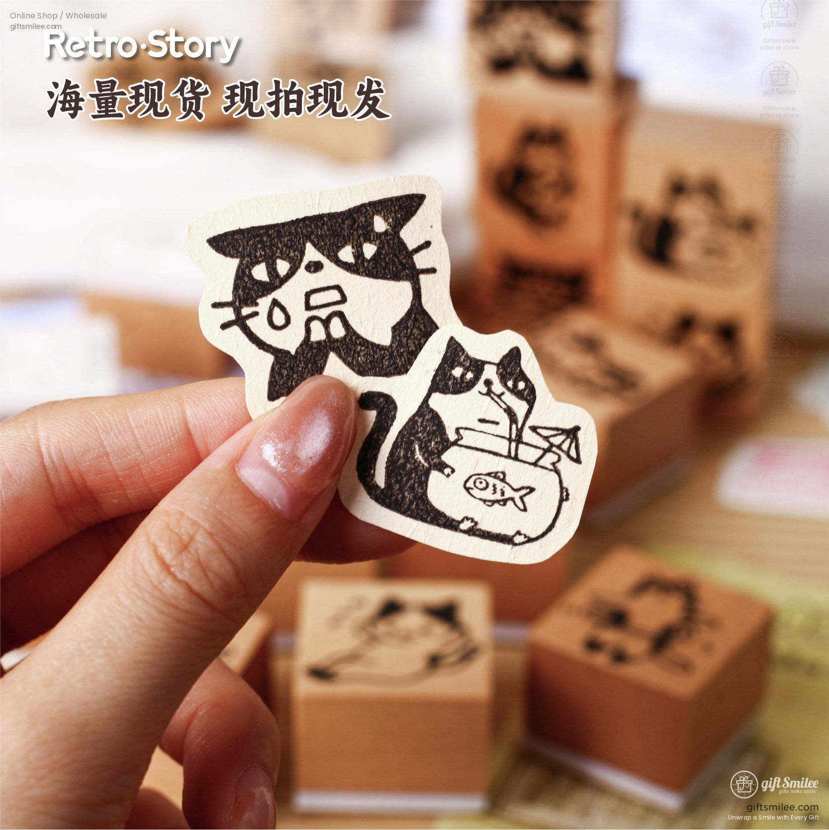 Close-up of a person holding a cute cat-themed rubber stamp with intricate black cat illustrations