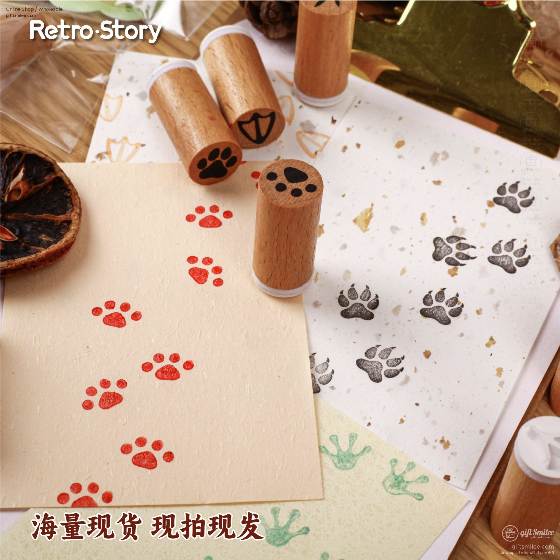 Colorful animal paw print stamp impressions on paper with wooden stamps nearby