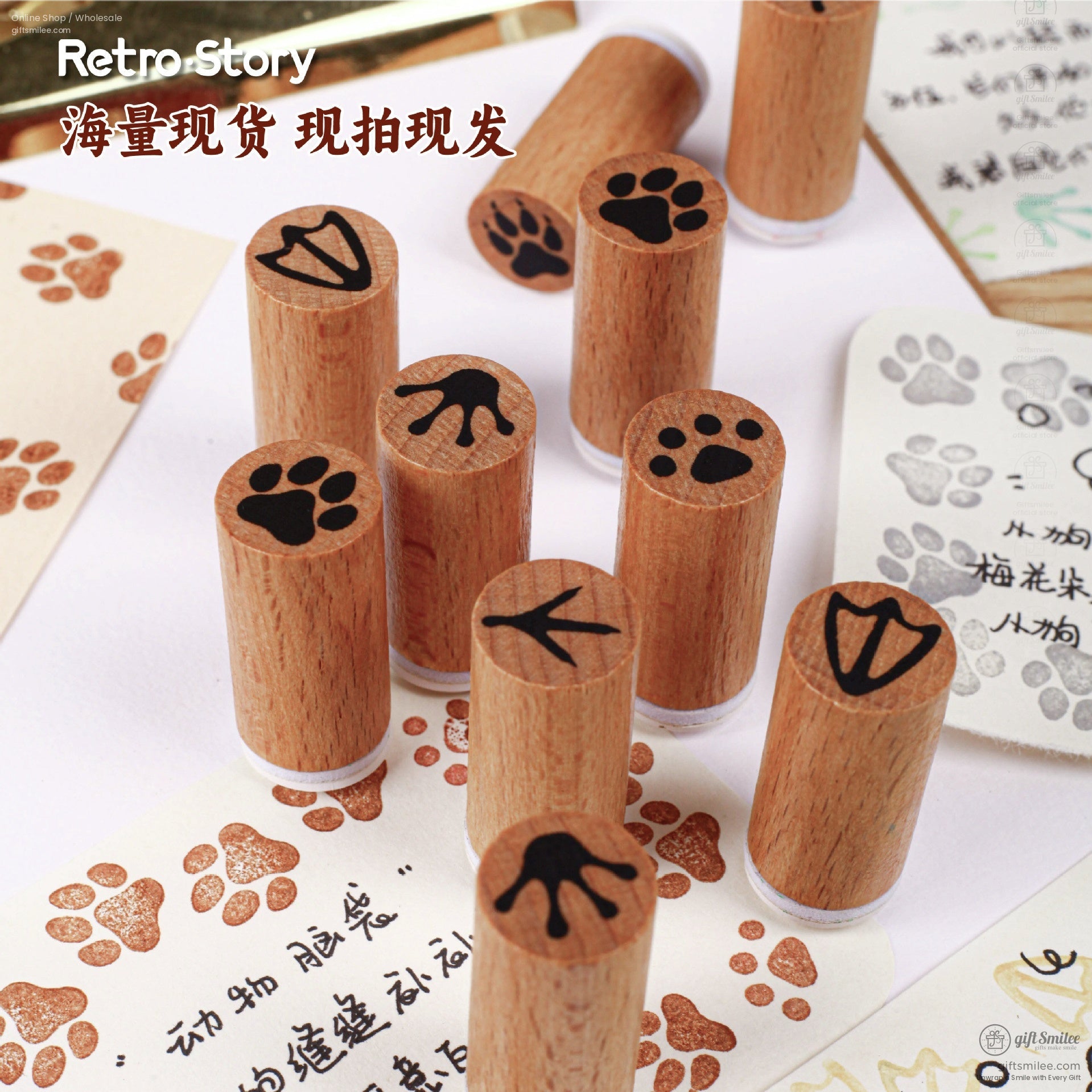 Multiple wooden rubber stamps featuring animal-inspired paw designs arranged on a table