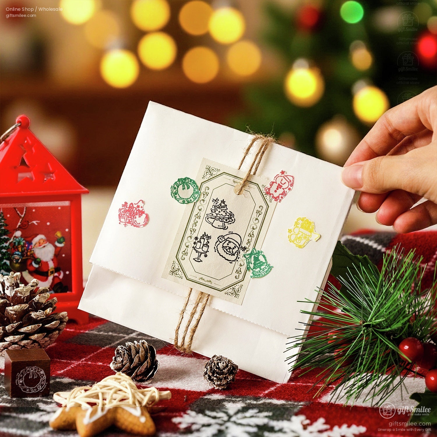 Holiday envelope decorated using the Christmas stamp set, surrounded by festive décor